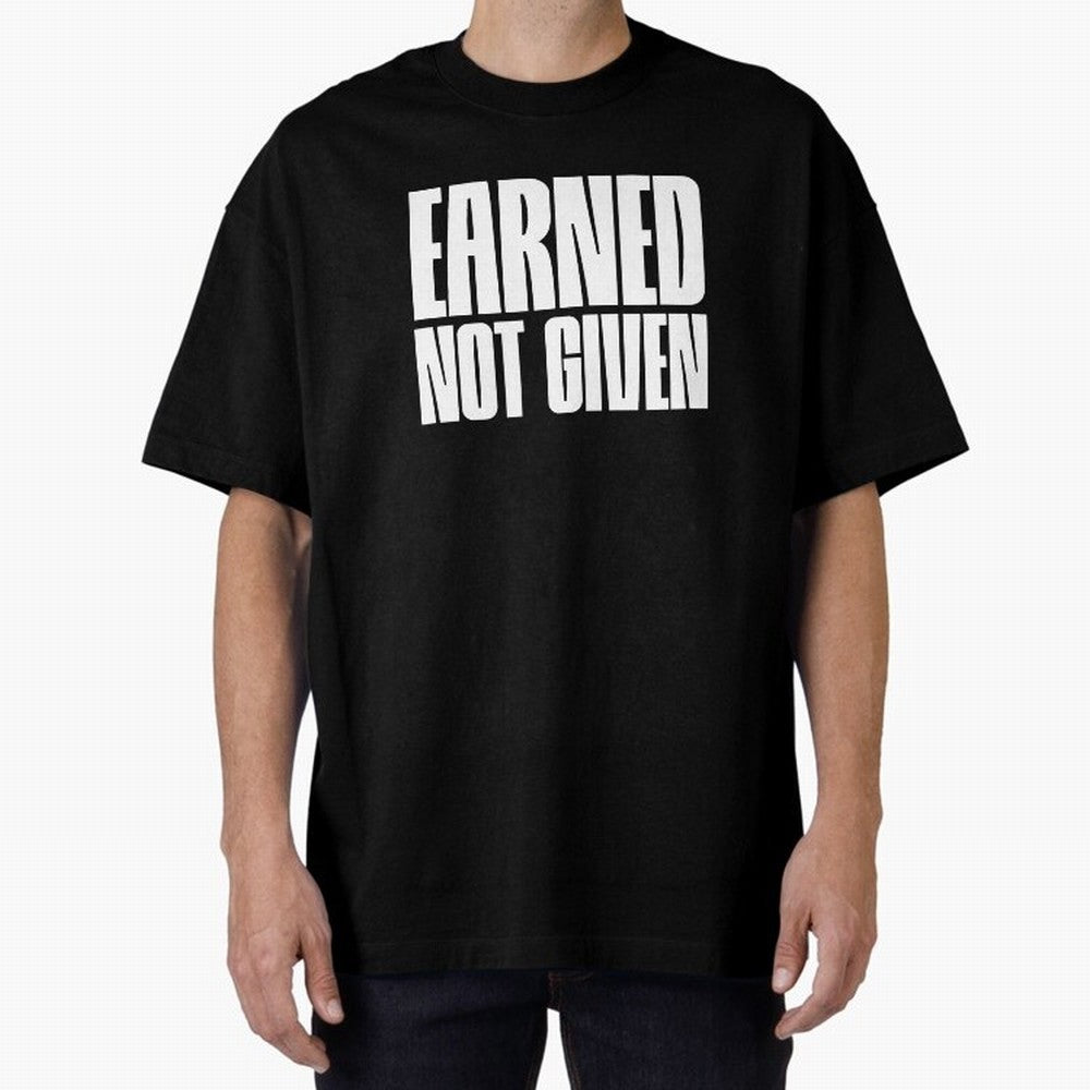 Earned not given white Oversized T-Shirt Support Iconic Players in Match Day Hype around FIFA World Cup 2026, Mbappe and Neymar, France, Goal Celebration Energy, Supporter Heritage, Football Icons and Worldwide Tournament Joy; Built for Supporters